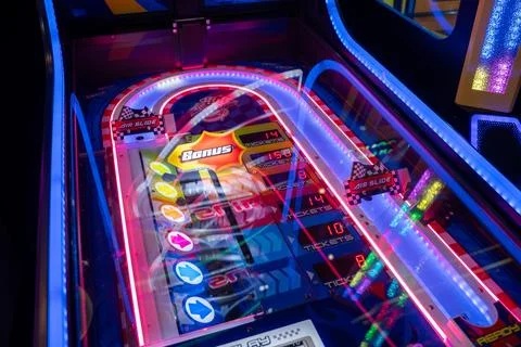 Close up of illuminated arcade ticket redemption game machine. Toronto, Canada - Stock Photos