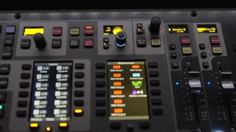 Close up illuminated audio knobs and sliders on professional mixing console 스톡 동영상 322085597