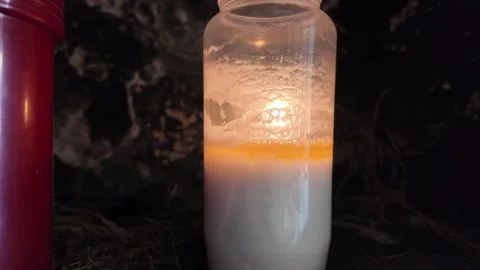 Close-up of illuminated candles in cave Stock Footage 317118745