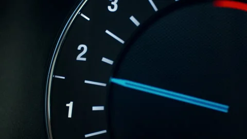 Close up of illuminated car tachometer on dashboard Stock Footage 333492457