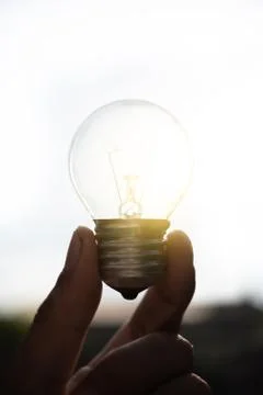 Close-Up Of Illuminated Light Bulb Stock Photos