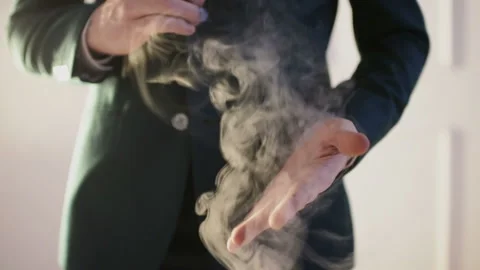 Close-up of Illusionist's hands performing trick with coin Video stock 106017697