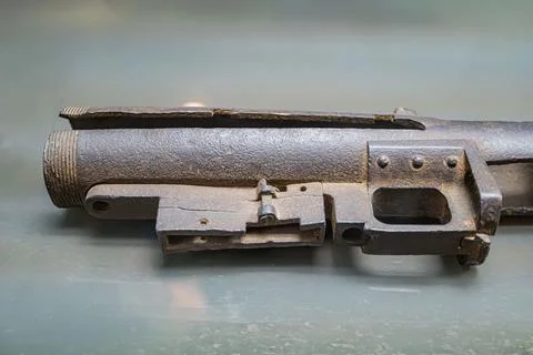 Close-up image of an aged, rusty revolver on a textured surface Realistic s.. Photos