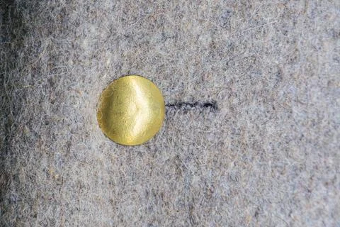 Close-up image of an antique military patch circular, golden yellow, textur.. Stock Photos