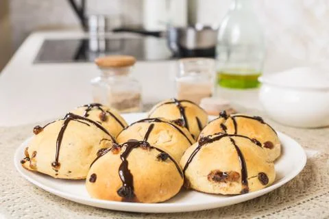 Close-up image of baked fresh cross buns. Home-made easter sweet bread on tab Stock Photos