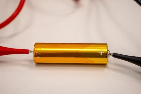 Close-up image of a battery connected with alligator clips Stock Photos