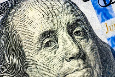 Close-up image of Benjamin Franklin on 100 bill. Finance concept. Stock Photos