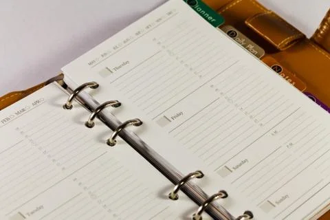 Close up image of black note book organizer against white background Stock Photos