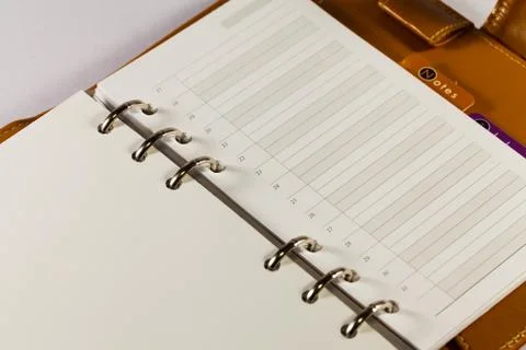 Close up image of black note book organizer against white background Stock Photos