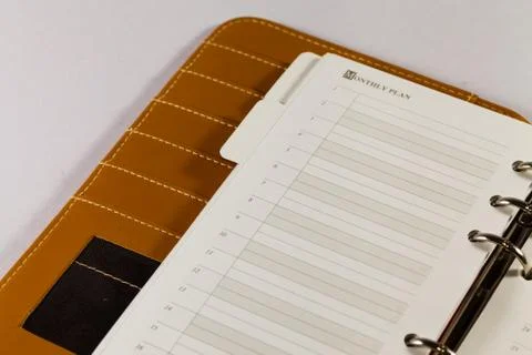 Close up image of black note book organizer against white background Stock Photos