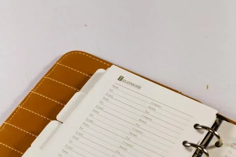 Close up image of black note book organizer against white background Stock Photos