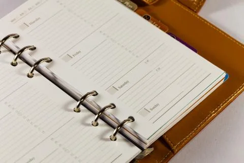 Close up image of black note book organizer against white background Stock Photos