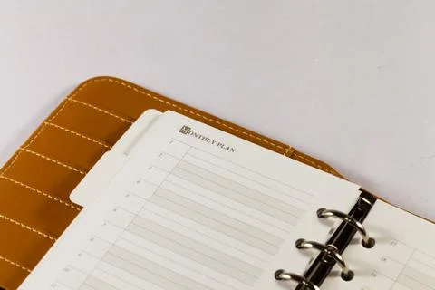 Close up image of black note book organizer against white background Stock Photos