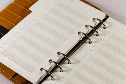 Close up image of black note book organizer against white background Foto stock