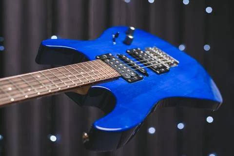 Close-up image of a blue electric guitar. Stock Photos