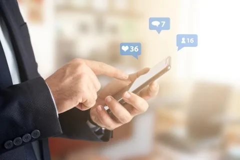 Close-up image of businessman hands using smartphone at office, searching or Stock Photos
