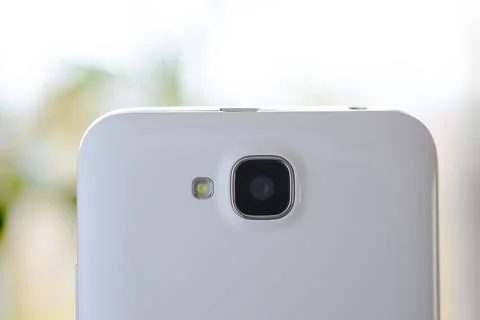 Close Up Image of the Camera of White Smart Phone 库存照片
