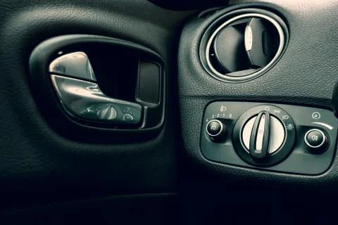 Close up image of a car interior, headlight switch, handle, conditioner Stock Photos