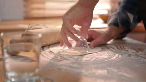 Close-up image of a chef's hand using a small glass bowl to rotate 動画素材 340180230