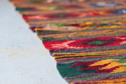 Close-up image of a colorful, patterned textile with an intricate design and  Stock Photos