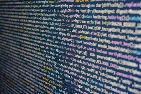 Close-up image of computer code on a screen, emphasizing complexity and preci 写真素材