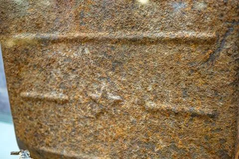 Close-up image of a corroded object with varying brown to black rust patche.. Stock Photos