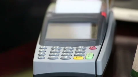 Close up image of a credit card being swiped through a card machine. Stock Footage