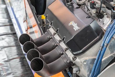Close-up image of a dark metallic Formula 1 engine, equipped with multiple ex Stock Photos