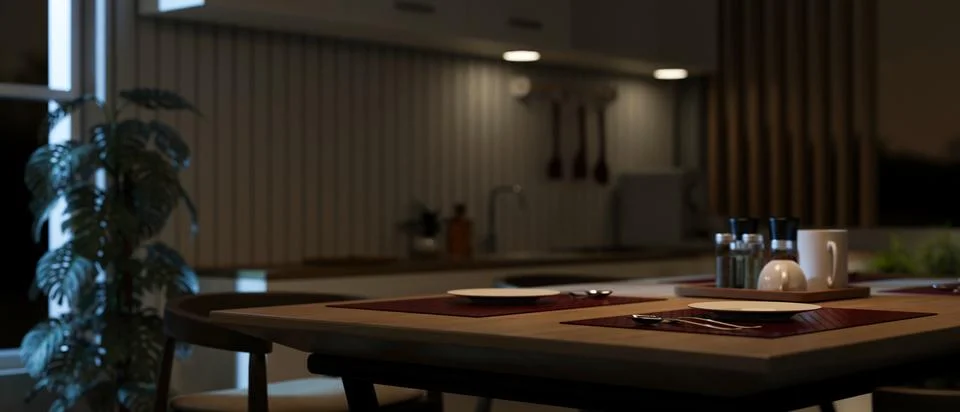 Close-up image of a dining table in a modern, romantic dining room at night.. Stock Illustration