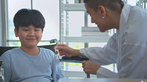 Close up image of a doctor using a thermometer during a child's examination Stock Footage 339069988