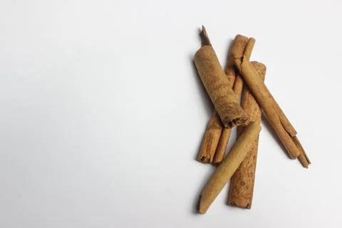 Close-up image of dried cinnamon isolated on white background. Stock Photos