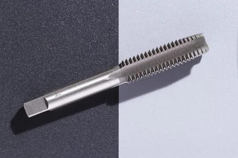 Close-up image of drill bit, or tap for threads in steel Stock Photos
