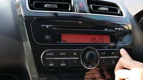 Close up image of driver's hand press button on car radio, listening music Stock Footage 142244967