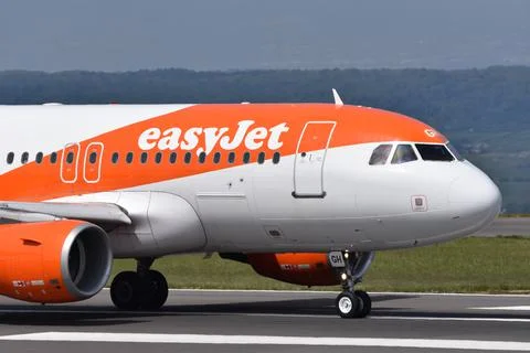 A close up image of an easyJet aeroplane going down the runway Stock Photos