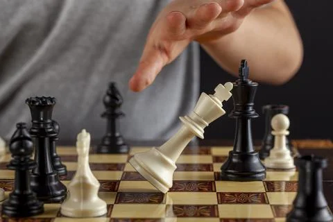 Close up image of the end of a chess came where the losing player resigns by  Stock Photos
