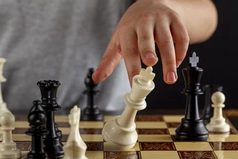 Close up image of the end of a chess game where the losing player resigns by  Stock Photos