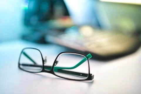 Close up image of eyeglasses on the desk Stock Photos