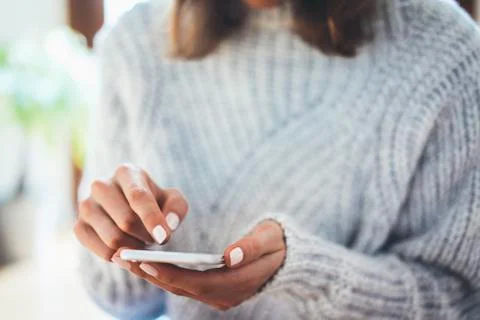 Close-up image of female hands using modern smartphone device at home Free Stock Photos