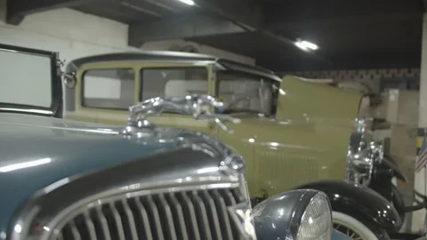 Close-up image of a garage with several old cars. Vídeos de archivo 136136934