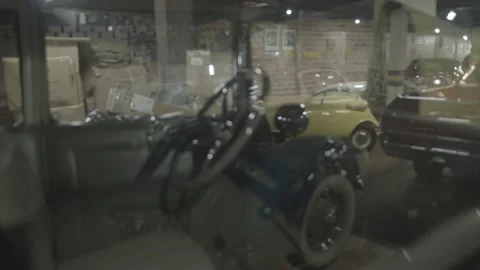 Close-up image of a garage with several old cars. Stock Footage 136137056