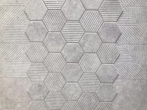 Close-up image of a geometric hexagonal tile surface with textured patterns,  Photos