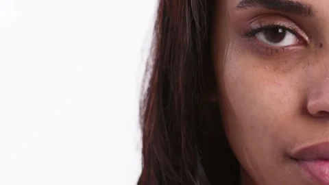 A close-up image of half a woman's face, capturing her natural beauty with an 스톡 동영상 268295397