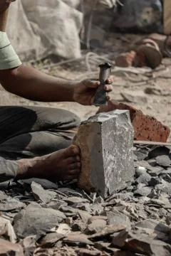 Close up image of hands of a young man giving stone sculpture at pune Stock Photos