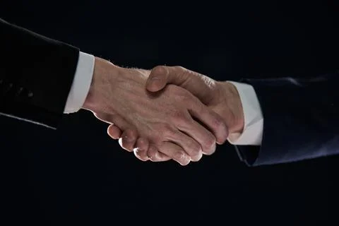 Close-up image of handshake between two colleagues. Stock Photos