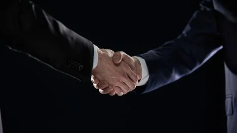 Close-up image of handshake between two colleagues. Stock Photos