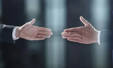 Close-up image of handshake between two colleagues. Stock Photos
