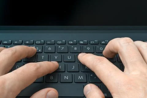Close up image of human hands typing on laptop computer keyboard Stock Photos