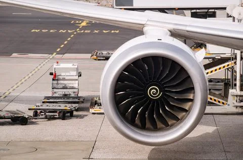 Close-up image of the jet engine and part of the wing of a modern jet airplane Foto stock