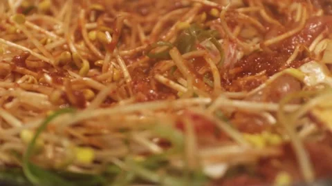 Close up image of Korean dish, spicy bean sprouts with bulgogi on a large pan. Stock Footage 132382358