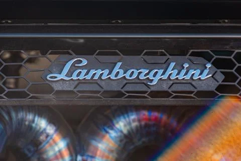 Close-up image of Lamborghini grille, featuring Lamborghini emblem on honey.. Fotos de archivo